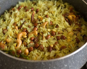 Puneri Chiwda is favorite snack during Diwali. Puneri chiwda is rice flakes with peanuts and spices