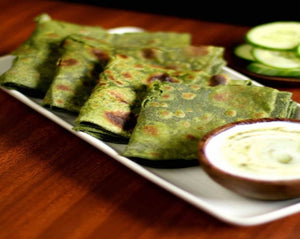 Palak paratha made of spinach whole wheat salt and spices