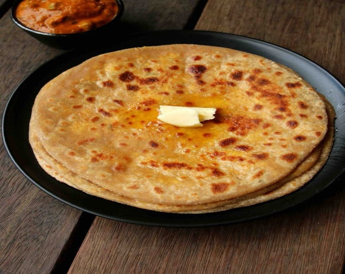 Whole Wheat Paratha is made with Whole wheat ,salt and butter.